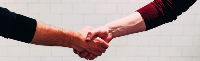 Two people shaking hands