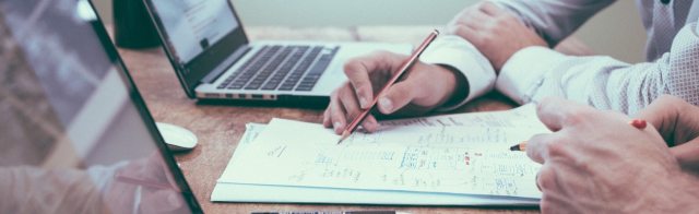 Two people reviewing paperwork