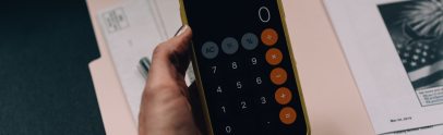 A person holding a calculator