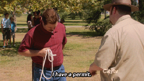 Ron Swanson from Parks and Rec saying, 'I have a permit,' and handing the officer a piece of paper that says 'I can do what I want.'